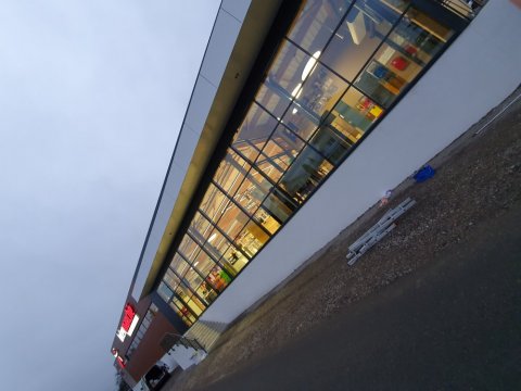 Nettoyage de la vitrerie deux faces d'Intermarché à Saint-Romain-Le-Puy